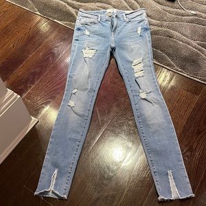 FRAME size 26 denim jeans with a zipper and button closure.